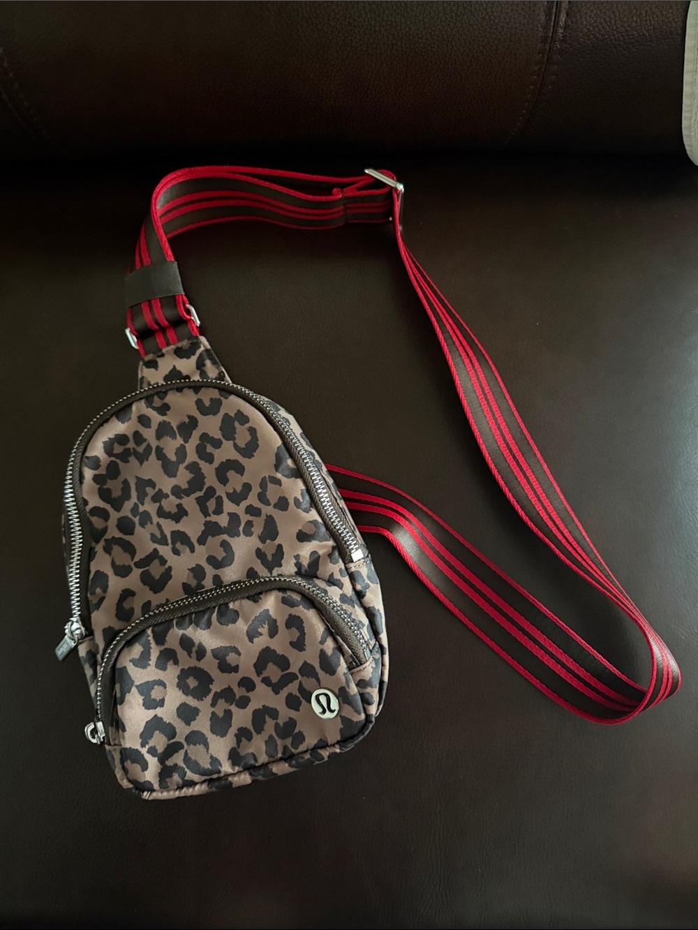Lululemon Leopard Print Crossbody Sling Bag with Red-Striped Strap 2L